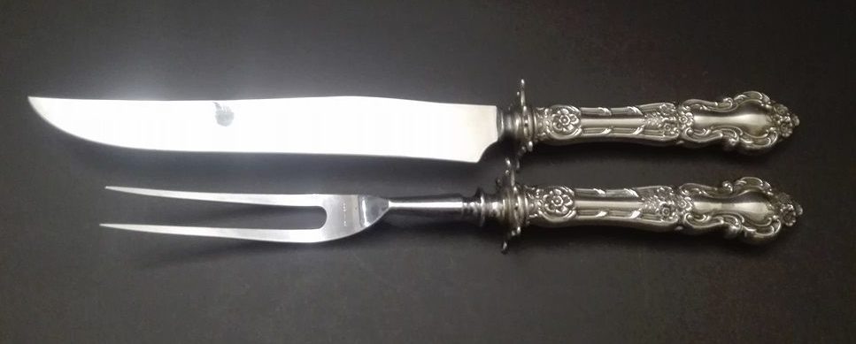 Транжирная вилка и нож для мяса